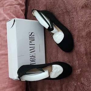 New, never worn black ballet flats with straps.